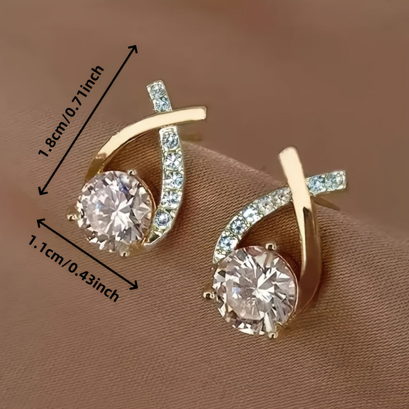 Örhängen med guldkors och zirconia