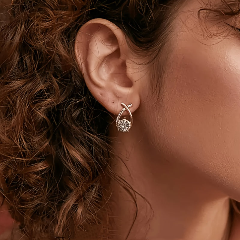 Örhängen med guldkors och zirconia