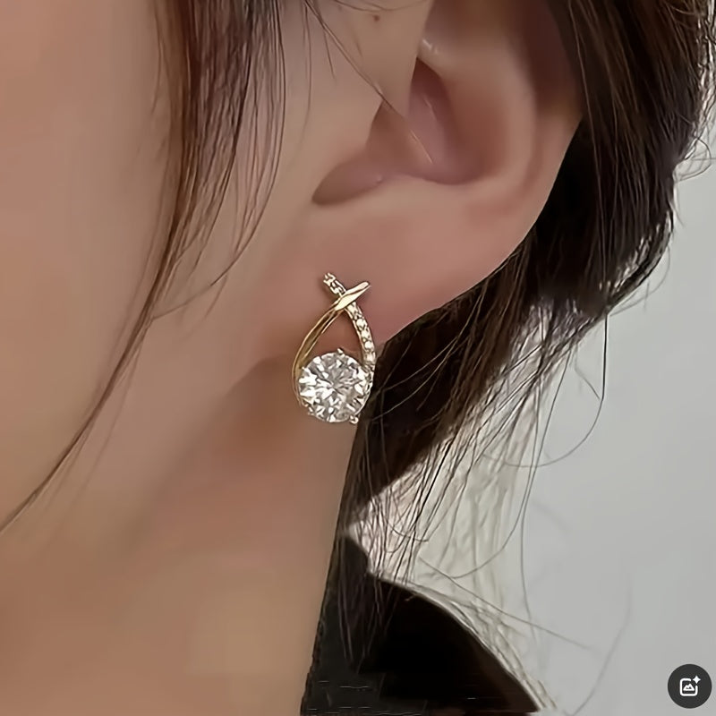 Örhängen med guldkors och zirconia