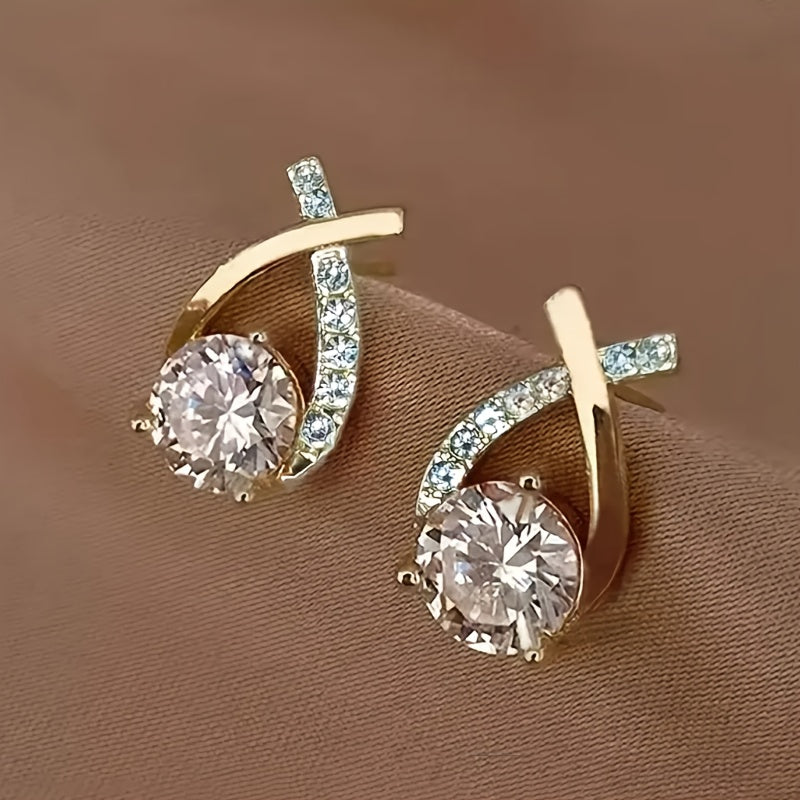Örhängen med guldkors och zirconia